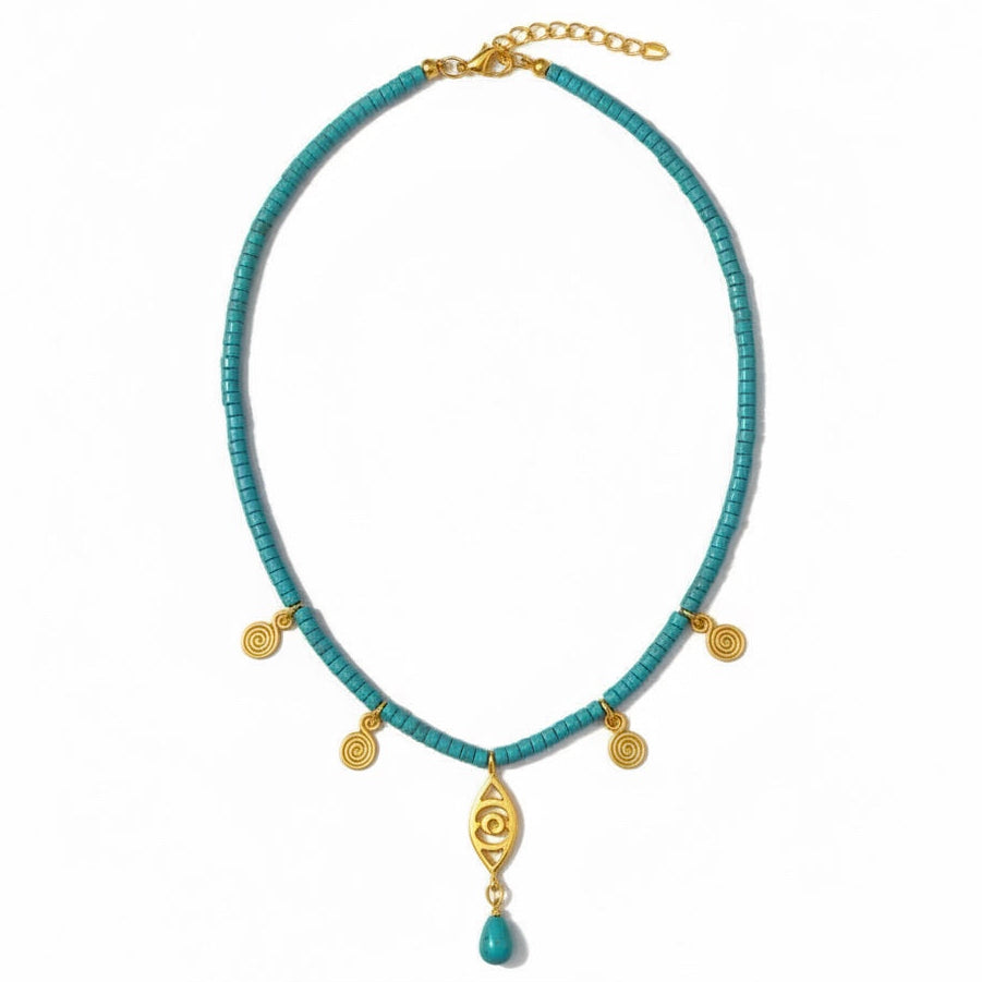 Turquoise beaded necklace with gold accents and a pendant on a white background
